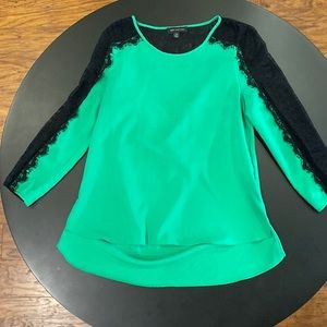 M M Couture black lace/ green. Open draping in the back. Size: Medium